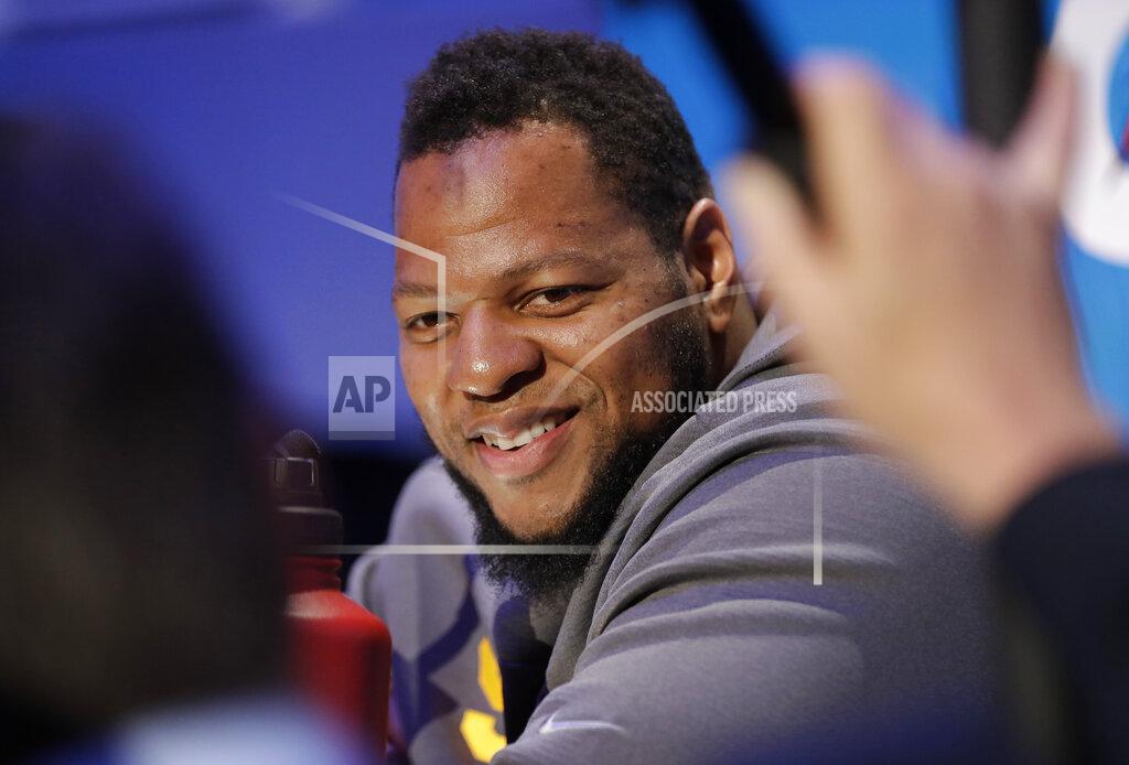 David J. Phillip Los Angeles Rams' Ndamukong Suh smiles during Opening Night for the NFL Super Bowl 53 football game Monday, Jan. 28, 2019, in Atlanta. (AP Photo/David J. Phillip)