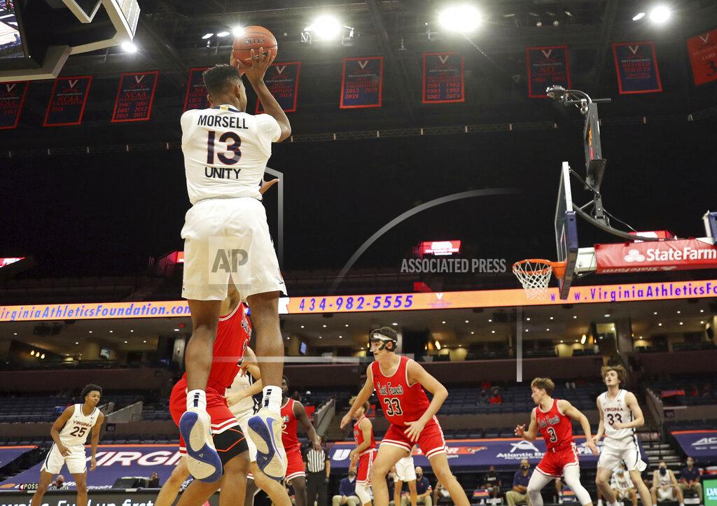 Andrew Shurtleff Virginia guard Casey Morsell (13) shoots a 3-pointerover St. Francis defenders during an NCAA college basketball game Tuesday, Dec. 1, 2020, in Charlottesville, Va. (Andrew Shurtleff/The Daily Progress via AP)
