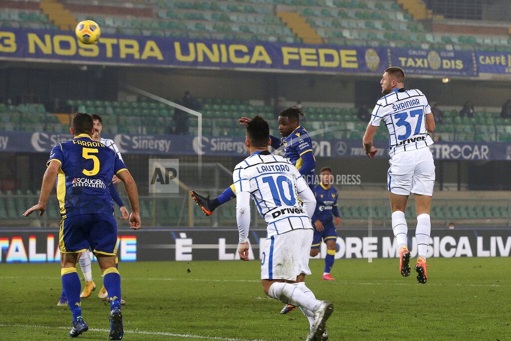 Paola Garbuio Inter Milan’s Milan Skriniar, right, scores his side's second goal during the Serie A soccer match between Verona and Inter Milan in Verona, Italy Wednesday, Dec. 23, 2020. (Paola Garbuio/LaPresse via AP)