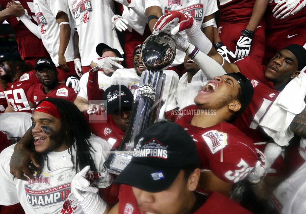 Eric Gay Washington State players celebrate their 28-26 win over Iowa State in the Alamo Bowl NCAA college football game, Friday, Dec. 28, 2018, in San Antonio. (AP Photo/Eric Gay)