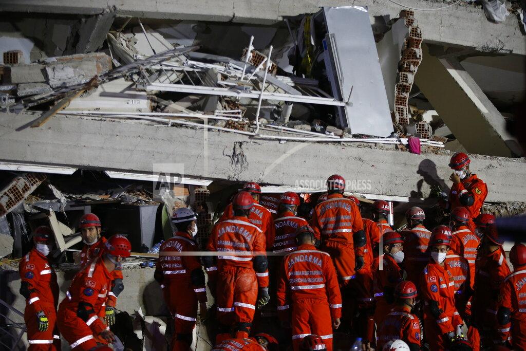Emrah Gurel Members of rescue services search in the debris of a collapsed building for survivors in Izmir, Turkey, early Saturday, Oct. 31, 2020. A strong earthquake struck Friday in the Aegean Sea between the Turkish coast and the Greek island of Samos, killing several people and injuring hundreds amid collapsed buildings and flooding. (AP Photo/Emrah Gurel)