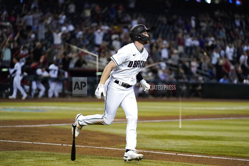 Ross D. Franklin Arizona Diamondbacks' Pavin Smith watches his home run against the Kansas City Royals during the sixth inning of a baseball game Tuesday, May 24, 2022, in Phoenix. (AP Photo/Ross D. Franklin)