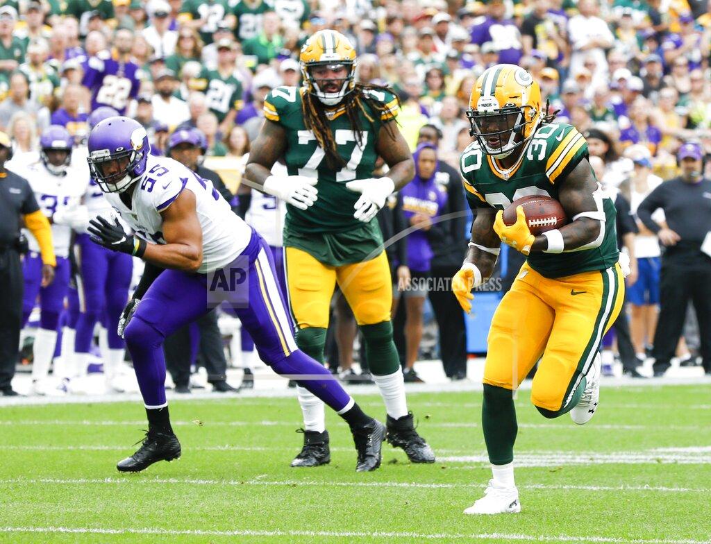 Mike Roemer Green Bay Packers' Jamaal Williams runs for a touchdown during the first half of an NFL football game against the Minnesota Vikings Sunday, Sept. 15, 2019, in Green Bay, Wis. (AP Photo/Mike Roemer)