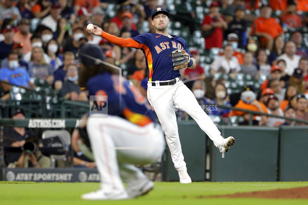 Michael Wyke Houston Astros third baseman Alex Bregman throws to first base over pitcher Lance McCullers Jr. for an out against Los Angeles Angels' Kurt Suzuki during the fifth inning of a baseball game Sunday, Sept. 12, 2021, in Houston. (AP Photo/Michael Wyke)