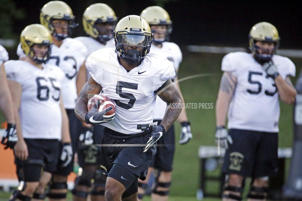 Mark Humphrey In this Aug. 5, 2019, photo, Vanderbilt running back Ke'Shawn Vaughn (5) runs a drill during an NCAA college football practice in Nashville, Tenn. Vanderbilt has won at least five games each of the past three seasons and reached two bowls in that span. They've also won three straight against in-state rival Tennessee for their longest winning streak in this series since the 1920s. (AP Photo/Mark Humphrey)