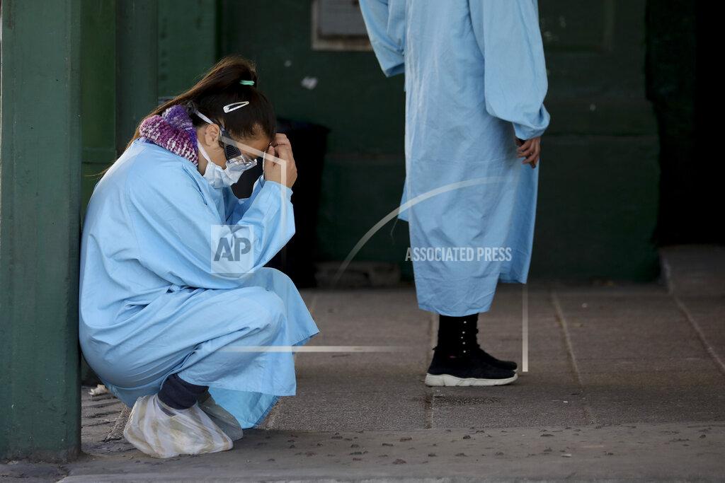 Natacha Pisarenko A worker rests outside the Manuel Belgrano public hospital on the outskirts of Buenos Aires, Argentina, Friday, April 17, 2020. Argentina confirmed a coronavirus outbreak at this hospital where people, including hospital staff, have tested positive, according to its director Nicolás Rodríguez. (AP Photo/Natacha Pisarenko)