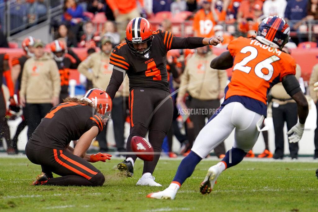Jack Dempsey Cleveland Browns kicker Austin Seibert (4) kicks a field goal as punter Jamie Gillan (7) holds as Denver Broncos cornerback Isaac Yiadom (26) defends during the first half of NFL football game, Sunday, Nov. 3, 2019, in Denver. (AP Photo/Jack Dempsey)