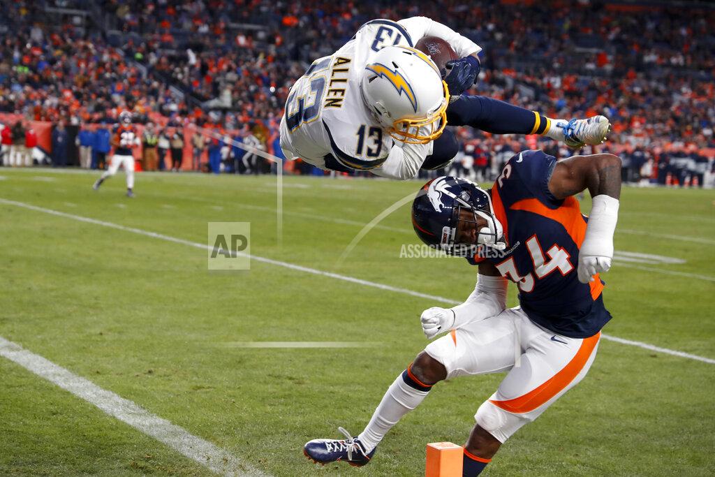 David Zalubowski Los Angeles Chargers wide receiver Keenan Allen scores over Denver Broncos strong safety Will Parks during the second half of an NFL football game Sunday, Dec. 1, 2019, in Denver. (AP Photo/David Zalubowski)