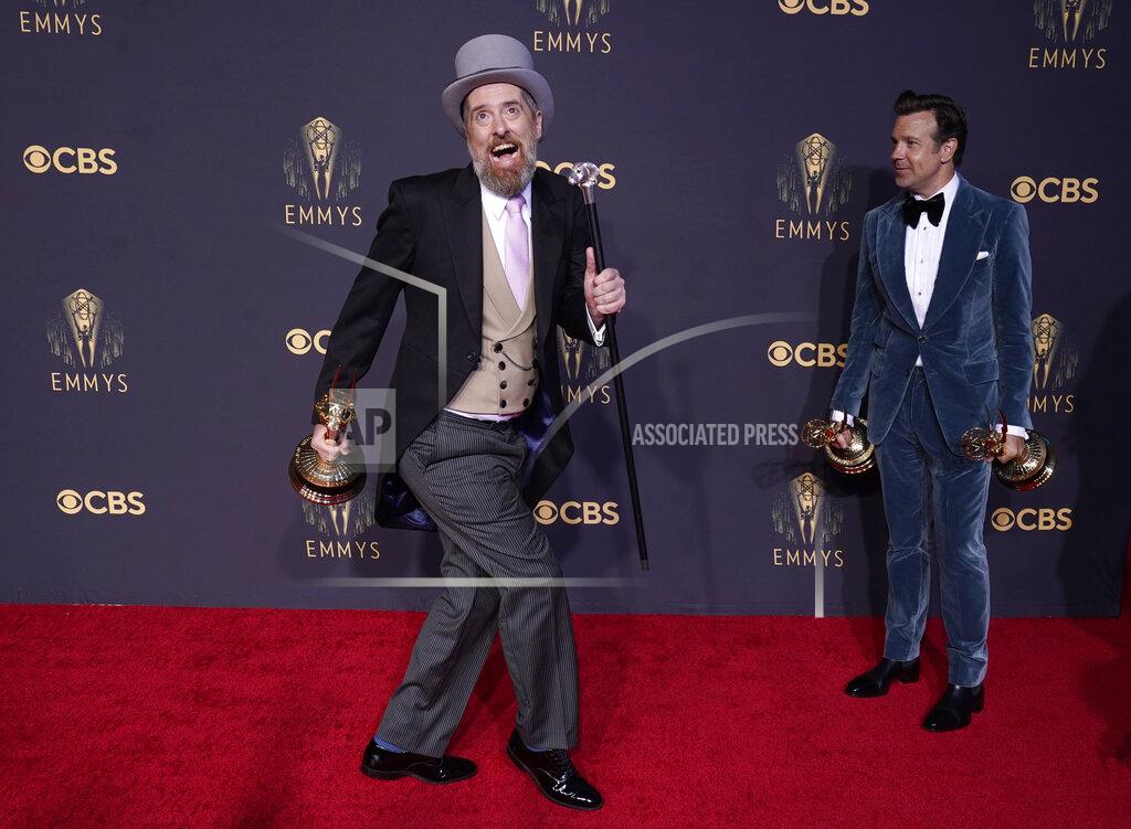 Chris Pizzello Brendan Hunt, left, and Jason Sudeikis pose with their awards for outstanding comedy series and outstanding lead actor in a comedy series for "Ted Lasso" at the 73rd Primetime Emmy Awards on Sunday, Sept. 19, 2021, at L.A. Live in Los Angeles. (AP Photo/Chris Pizzello)