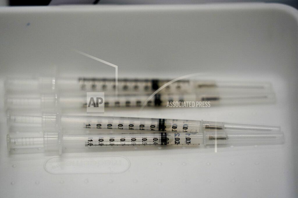 Wilfredo Lee FILE - This April 15, 2021, file photo syringes filled with the Pfizer COVID-19 vaccine are shown at the Christine E. Lynn Rehabilitation center in Jackson Memorial hospital in Miami. With vaccination rates lagging in red states, Republican leaders have begun stepping up efforts to persuade their supporters to get the shot, at times combating misinformation spread by some of their own. (AP Photo/Wilfredo Lee, File)