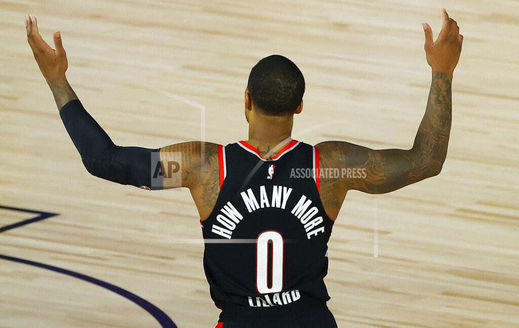 Kevin C. Cox Portland Trail Blazers' Damian Lillard calls for a foul against the Memphis Grizzlies during the second half of an NBA basketball game Saturday, Aug. 15, 2020, in Lake Buena Vista, Fla. (Kevin C. Cox/Pool Photo via AP)