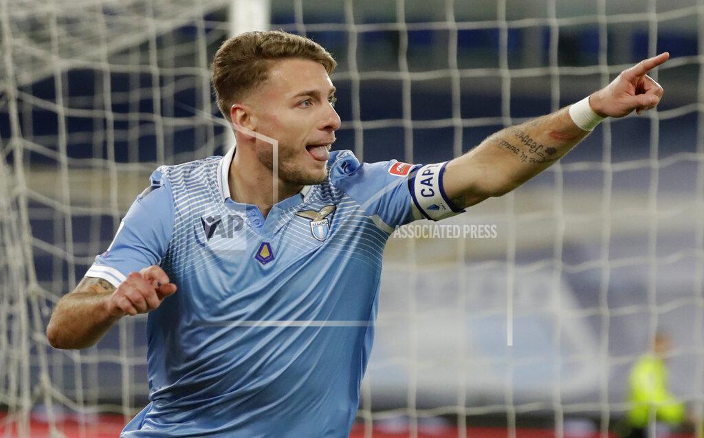 Andrew Medichini Lazio's Ciro Immobile celebrates after scoring his sides first goal during the Serie A soccer match between Lazio and Roma, at Rome's Olympic Stadium, Friday, Jan. 15, 2021. (AP Photo/Andrew Medichini)