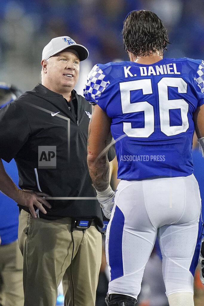 Bryan Woolston Kentucky head coach Mark Stoops speaks with Kentucky linebacker Kash Daniel (56) during the second half of an NCAA college football game between Kentucky and Eastern Michigan, Saturday, Sept. 7, 2019, in Lexington, Ky. (AP Photo/Bryan Woolston)