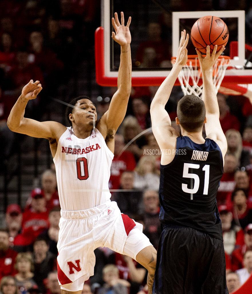 Francis Gardler Butler's Nate Fowler (51) shoots a 3-pointer as Nebraska guard James Palmer Jr. (0) defends during the first half of an NCAA college basketball game in the NIT on Wednesday, March 20, 2019, in Lincoln, Neb. (Francis Gardler/Lincoln Journal Star via AP)