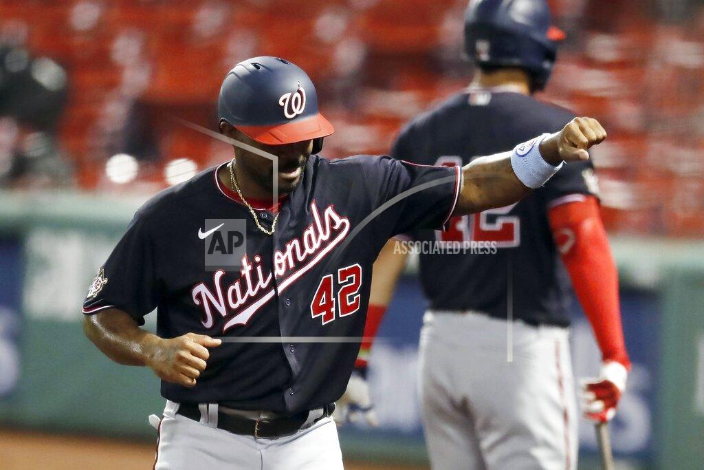 Michael Dwyer Washington Nationals' Howie Kendrick celebrates after scoring on a single by Adam Eaton during the third inning of a baseball game against the Boston Red Sox, Saturday, Aug. 29, 2020, in Boston. (AP Photo/Michael Dwyer)