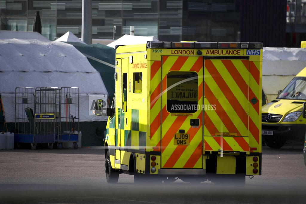 Alberto Pezzali Ambulances and camp tents are seen outside the Excel in London, Saturday, March 28, 2020.The British Government announced Tuesday, that the ExCel Center in east London will become a 4,000 bed temporary hospital to deal with future coronavirus patients, to be called NHS Nightingale. The new coronavirus causes mild or moderate symptoms for most people, but for some, especially older adults and people with existing health problems, it can cause more severe illness or death.(AP Photo/Alberto Pezzali)