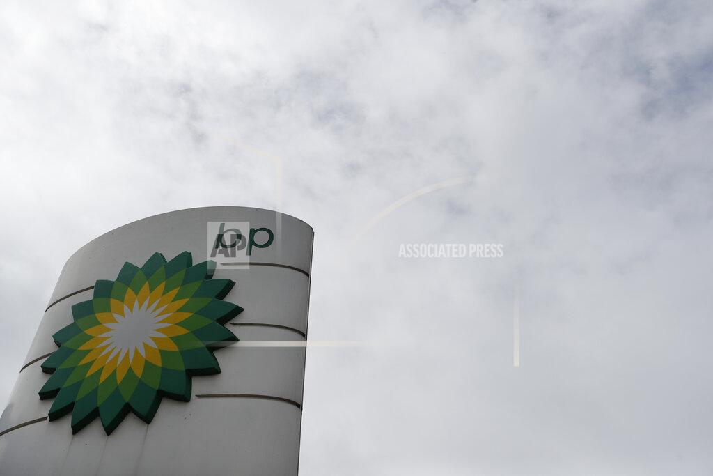 FILE - This Aug. 4, 2020 file photo shows the logo of British Petroleum in west London. Oil giants Exxon and BP have reported staggering losses for 2020 as the pandemic crushed energy demand and caused oil prices to tumble. (AP Photo/Alastair Grant, File)