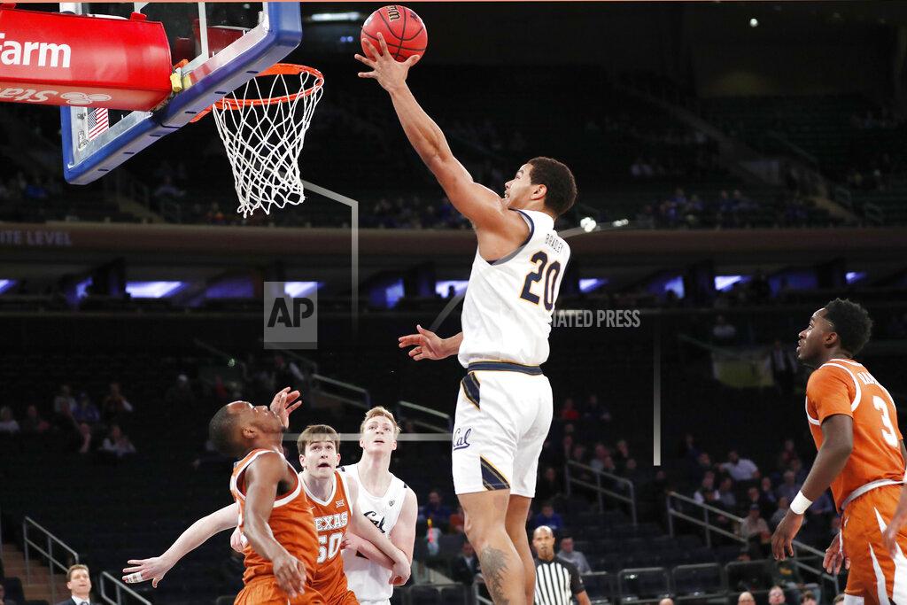 Kathy Willens California guard Matt Bradley (20) goes up for a layup as Texas guard Matt Coleman III, far left, Texas center Will Baker (50) and California forward Lars Thiemann (21) watch from the floor during the first half of an NCAA college basketball game in the 2K Empire Classic, Friday, Nov. 22, 2019, in New York. Texas guard Courtney Ramey (3) is at far right.(AP Photo/Kathy Willens)