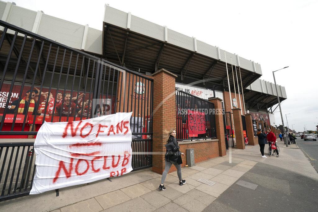 Jon Super Banners are seen outside Liverpool's Anfield Stadium after the collapse of English involvement in the proposed European Super League, Liverpool, England, Wednesday, April 21, 2021. Liverpool owner John W Henry has apologised to the club's supporters for the "disruption" caused by the proposed European Super League (ESL). (AP Photo/Jon Super)