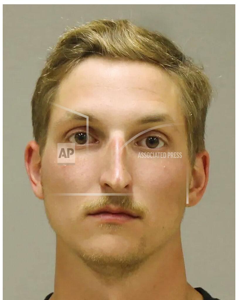 Uncredited In a photo provided by the Kent County Sheriff, Daniel Harris is shown in a booking photo. Harris is one of several people charged with plotting to kidnap Michigan Democratic Gov. Gretchen Whitmer, authorities said Thursday, Oct. 8, 2020, in announcing charges in an alleged scheme that involved months of planning and even rehearsals to snatch Whitmer from her vacation home. (Kent County Sheriff via AP)