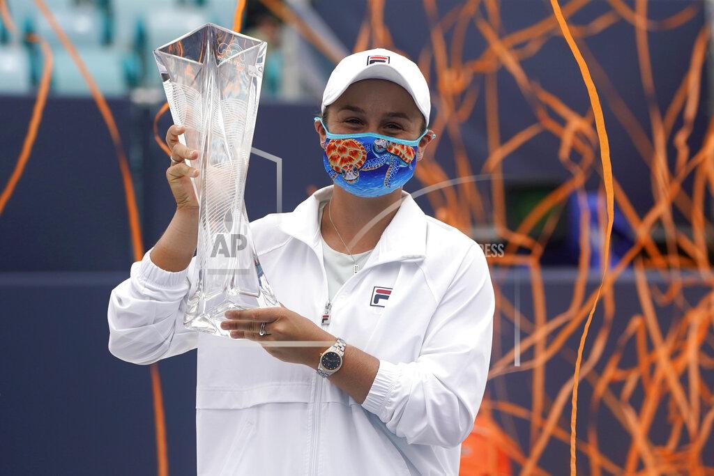 Lynne Sladky Ashleigh Barty of Australia poses with the trophy after winning her match against Bianca Andreescu of Canada during the finals at the Miami Open tennis tournament, Saturday, April 3, 2021, in Miami Gardens, Fla. Barty won 6-3, 4-0, as Andreescu retired due to injury. (AP Photo/Lynne Sladky)