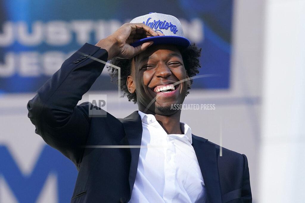 Jeff Chiu FILE - In this Nov. 19, 2020, file photo, Golden State Warriors draft pick James Wiseman laughs during a news conference in San Francisco. The 7-foot-1 Wiseman played only three college games as a freshman at Memphis. (AP Photo/Jeff Chiu, File)