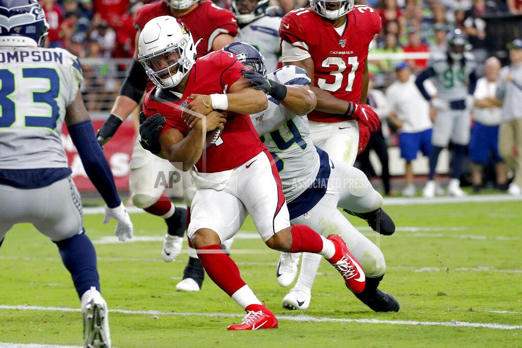 Ross D. Franklin Arizona Cardinals quarterback Kyler Murray (1) scores a touchdown as Seattle Seahawks middle linebacker Bobby Wagner defends during the second half of an NFL football game, Sunday, Sept. 29, 2019, in Glendale, Ariz. (AP Photo/Ross D. Franklin)
