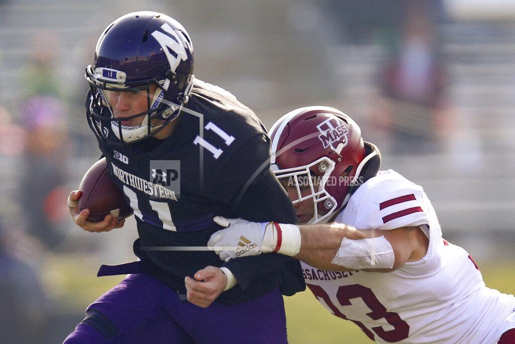 Jim Young Northwestern's Aidan Smith, left, is tackled by Massachusetts's Mike Ruane during the first half of an NCAA college football game Saturday, Nov. 16, 2019, in Evanston, Ill. (AP Photo/Jim Young)