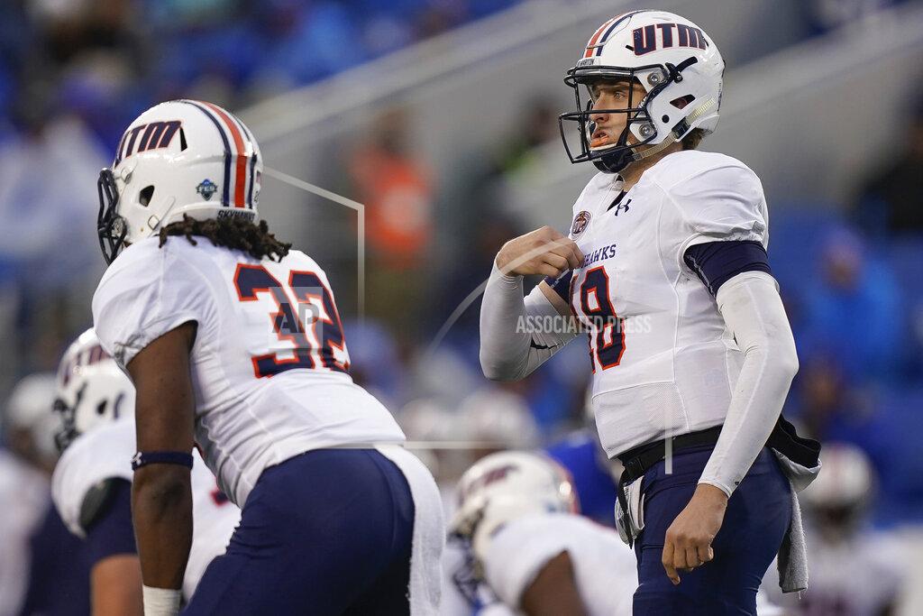 Bryan Woolston UT Martin quarterback John Bachus III (18) signals teammates during the first half of an NCAA college football game against Kentucky, Saturday, Nov. 23, 2019, in Lexington, Ky. (AP Photo/Bryan Woolston)