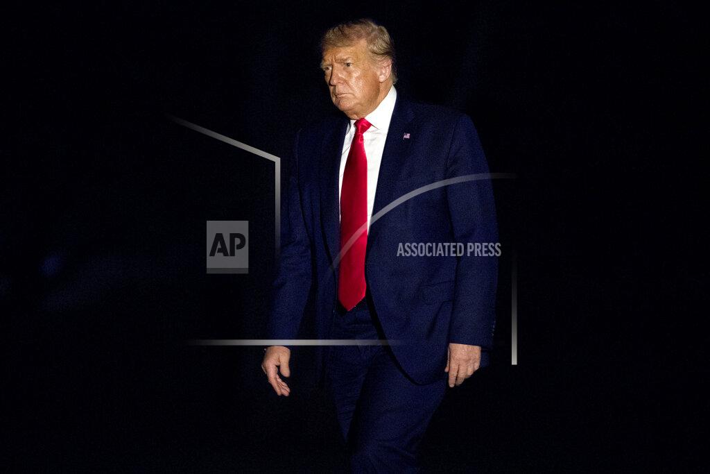 FILE - In this July 10, 2020, file photo President Donald Trump walks across the South Lawn of the White House in Washington as he returns from a trip to Florida. (AP Photo/Andrew Harnik, File)