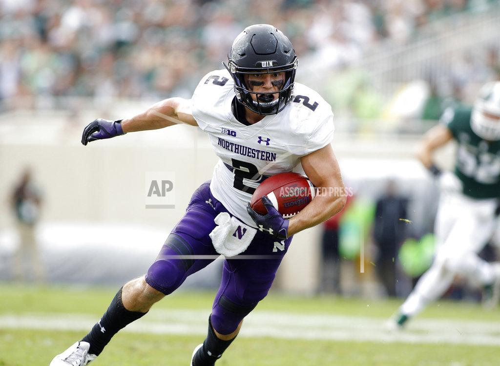 Al Goldis Northwestern's Flynn Nagel runs after a pass reception against Michigan State during the third quarter of an NCAA college football game, Saturday, Oct. 6, 2018, in East Lansing, Mich. Northwestern won 29-19. (AP Photo/Al Goldis)
