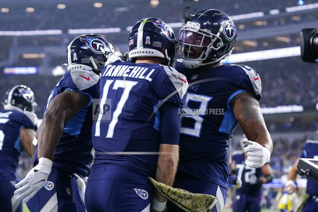 Marcio Jose Sanchez Tennessee Titans quarterback Ryan Tannehill, center, celebrates with teammate running back Adrian Peterson, right, and others after scoring a touchdown during the first half of an NFL football game against the Los Angeles Rams, Sunday, Nov. 7, 2021, in Inglewood, Calif. (AP Photo/Marcio Jose Sanchez)