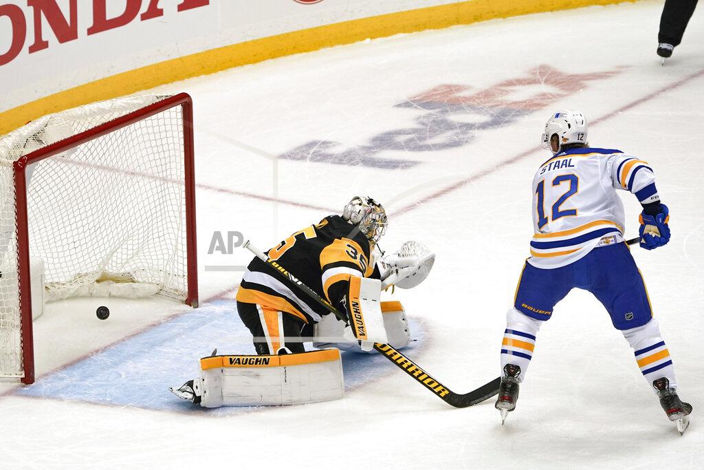Keith Srakocic Buffalo Sabres' Eric Staal (12) watches as a shot by Rasmus Dahlin gets by Pittsburgh Penguins' Tristan Jarry (35) for a goal during the first period of an NHL hockey game, Wednesday, March 24, 2021, in Pittsburgh. (AP Photo/Keith Srakocic)