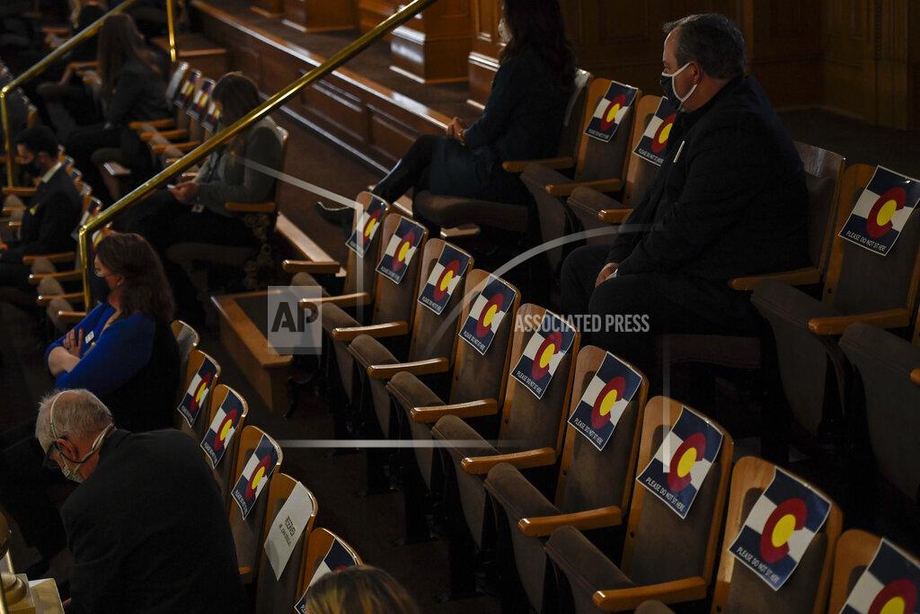 Aaron Ontiveroz Gov. Jared Polis delivers his state of the state address in front of the House of Representatives as chairs keep people in the gallery social distanced at the Colorado State Capitol Building in Denver on Wednesday, Feb. 17, 2021. (AAron Ontiveroz/The Denver Post via AP, Pool)