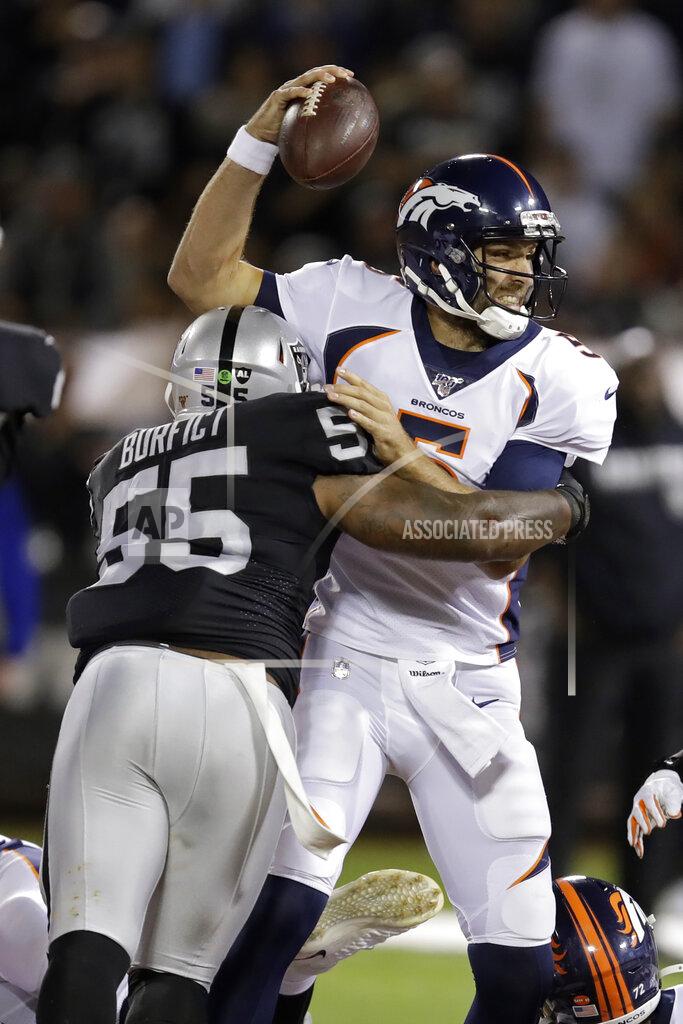 Ben Margot Denver Broncos quarterback Joe Flacco is tackled by Oakland Raiders outside linebacker Vontaze Burfict (55) during the first half of an NFL football game Monday, Sept. 9, 2019, in Oakland, Calif. (AP Photo/Ben Margot)