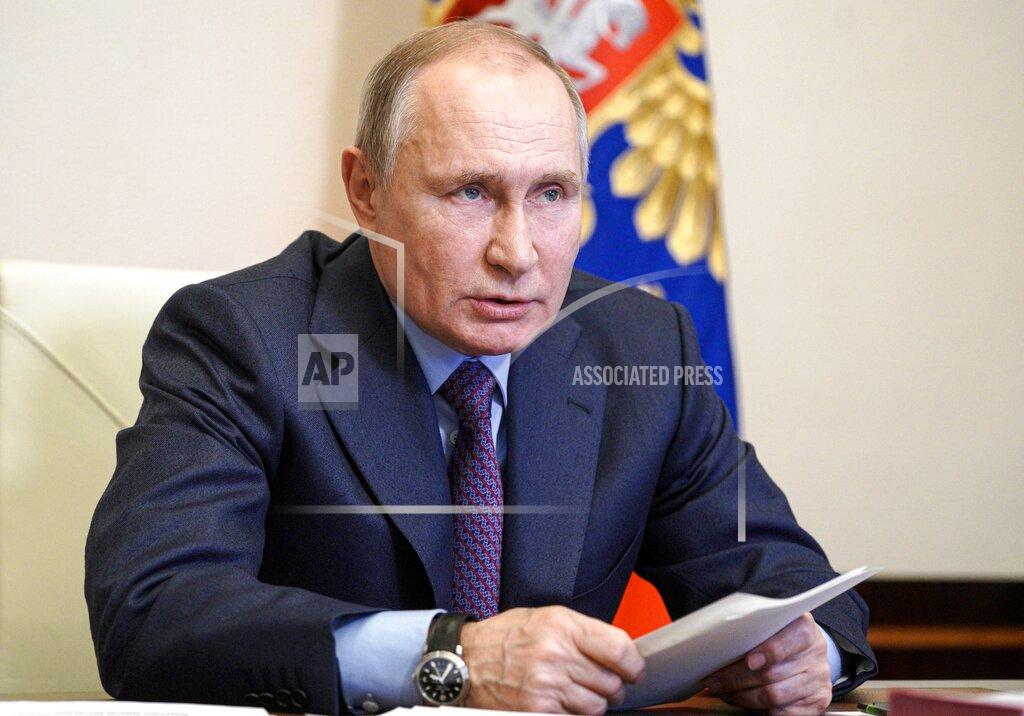 Russian President Vladimir Putin speaks during a meeting with government officials via video conference at the Novo-Ogaryovo residence outside Moscow, Russia, Monday, March 22, 2021. Putin said he will get vaccinated against the coronavirus on Tuesday, months after widespread vaccination has started in Russia. (Alexei Druzhinin, Sputnik, Kremlin Pool Photo via AP)