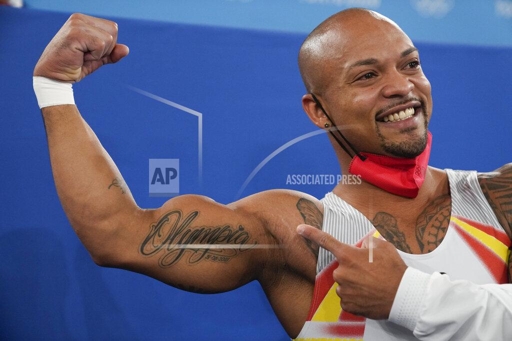 Natacha Pisarenko Rayderley Zapata of Spain, poses for a picture after his performance on the floor exercise during the artistic gymnastics men's apparatus final at the 2020 Summer Olympics, Sunday, Aug. 1, 2021, in Tokyo. (AP Photo/Natacha Pisarenko)