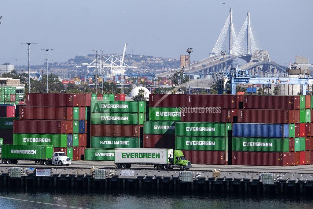 Ringo H.W. Chiu Cargo containers sit stacked at the Port of Los Angeles, Wednesday, Oct. 20, 2021 in San Pedro, Calif. California Gov. Gavin Newsom on Wednesday issued an order that aims to ease bottlenecks at the ports of Los Angeles and Long Beach that have spilled over into neighborhoods where cargo trucks are clogging residential streets. (AP Photo/Ringo H.W. Chiu)