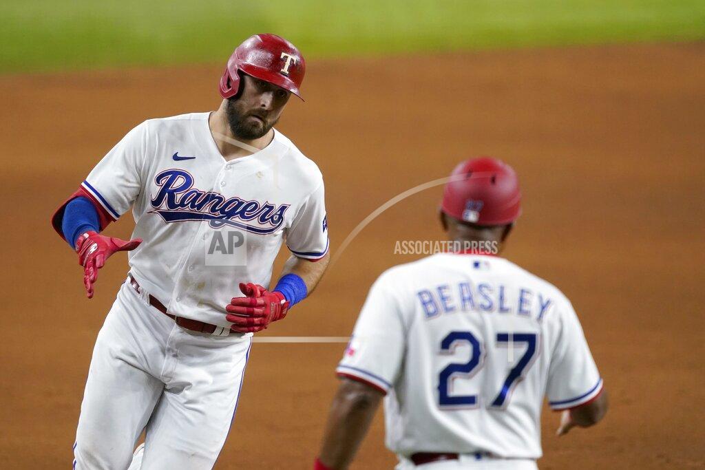 Tony Gutierrez Texas Rangers' Joey Gallo, left, celebrates with third base coach Tony Beasley (27) after hitting a three-run home run off of Arizona Diamondbacks' Taylor Widener during the fourth inning of a baseball game in Arlington, Texas, Tuesday, July 27, 2021. (AP Photo/Tony Gutierrez)