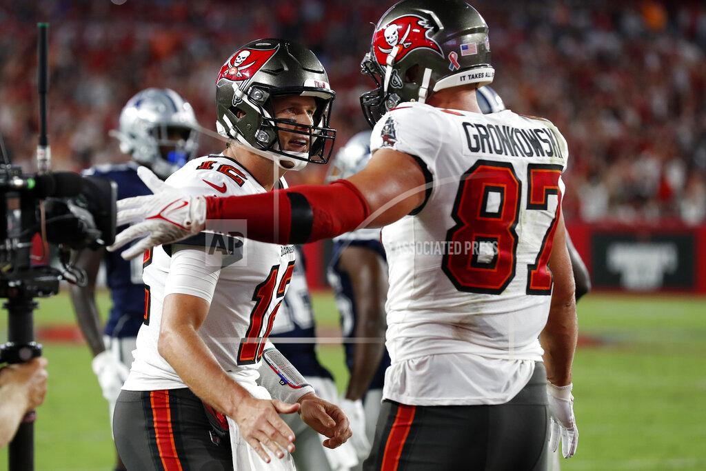 Scott Audette Tampa Bay Buccaneers quarterback Tom Brady (12) celebrates with tight end Rob Gronkowski (87) after Gronkowski caught a 2-yard touchdown pass during the first half of an NFL football game Thursday, Sept. 9, 2021, in Tampa, Fla. (AP Photo/Scott Audette)