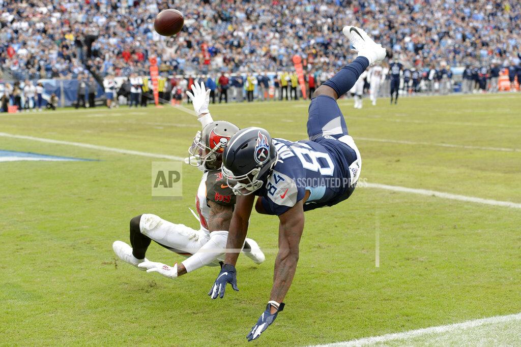 Mark Zaleski Tampa Bay Buccaneers cornerback Carlton Davis (33) breaks up a pass intended for Tennessee Titans wide receiver Corey Davis (84) in the second half of an NFL football game Sunday, Oct. 27, 2019, in Nashville, Tenn. (AP Photo/Mark Zaleski)