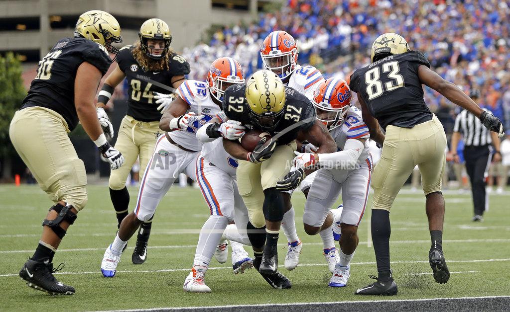 Mark Humphrey Vanderbilt running back Jamauri Wakefield (32) scores a touchdown against Vanderbilt in the first half of an NCAA college football game Saturday, Oct. 13, 2018, in Nashville, Tenn. (AP Photo/Mark Humphrey)