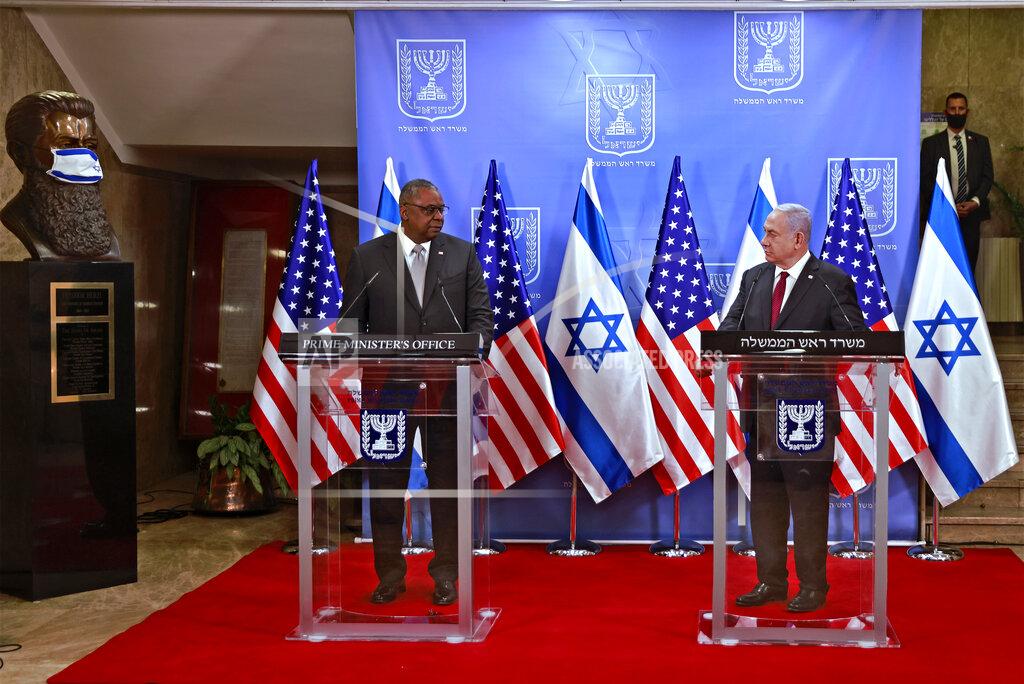 Menahem Kahana U.S. Defense Secretary Lloyd Austin, left, and Israeli Prime Minister Benjamin Netanyahu give statements after their meeting, at the prime minister's office, in Jerusalem, Monday, April 12, 2021. (Menahem Kahana/Pool via AP)