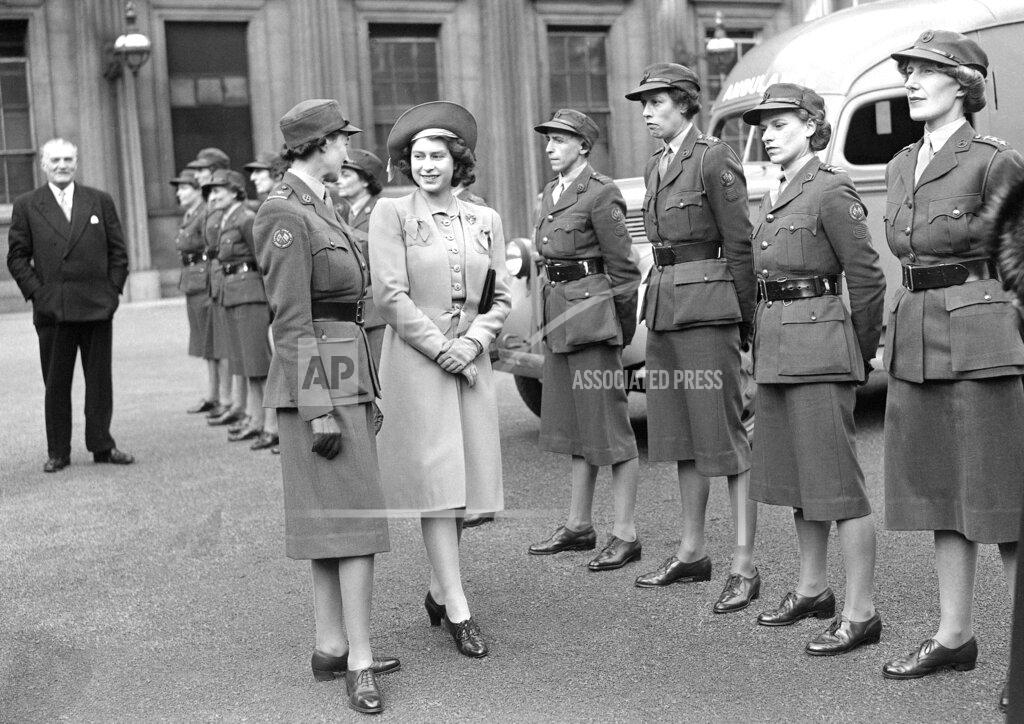 Uncredited FILE - Britain's Princess Elizabeth talks to an ambulance officer at a stand-down parade at Buckingham Palace in London, on Oct. 24, 1945. (AP Photo, File)