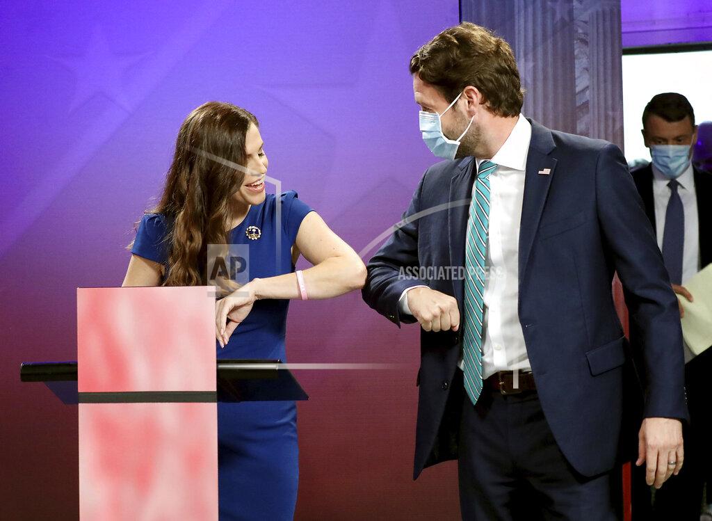 Grace Beahm Alford Republican challenger and state Rep. Nancy Mace and Democratic U.S. Rep. Joe Cunningham greet each other prior to their debate, Monday, Sept. 28, 2020, at the SCETV studios in Beaufort, S.C., in South Carolina's 1st Congressional District seat race. (Grace Beahm Alford/The Post And Courier via AP)