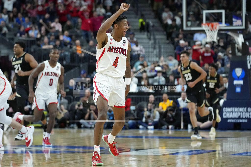 John Locher Arizona's Dalen Terry (4) celebrates after a play against Colorado during the second half of an NCAA college basketball game in the semifinal round of the Pac-12 tournament Friday, March 11, 2022, in Las Vegas. (AP Photo/John Locher)
