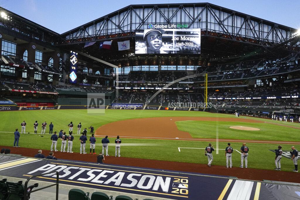 Tony Gutierrez The Atlanta Braves and the Los Angeles Dodgers stand during a moment of silence for Hall of Fame player Joe Morgan, who died Sunday, before Game 1 of a baseball National League Championship Series Monday, Oct. 12, 2020, in Arlington, Texas. (AP Photo/Tony Gutierrez)