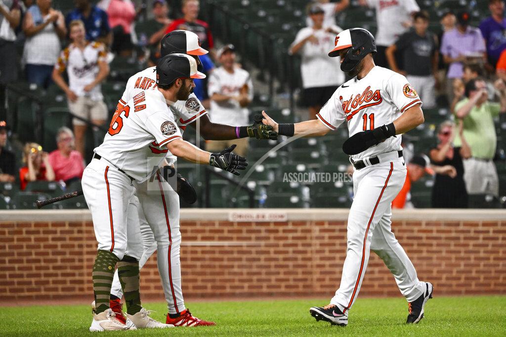 Terrance Williams Baltimore Orioles' Chris Owings (11) is greeted by Ryan McKenna, left, and Jorge Mateo after scoring a run on a hit by Austin Hays against Tampa Bay Rays starting pitcher Ryan Thompson during the ninth inning of a baseball game, Sunday, May 22, 2022, in Baltimore. (AP Photo/Terrance Williams)