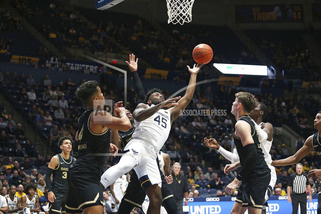 Kathleen Batten West Virginia guard Seth Wilson (45) shoots against Oakland during the second half of an NCAA college basketball game in Morgantown, W.Va., Tuesday, Nov. 9, 2021. (AP Photo/Kathleen Batten)