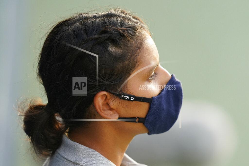 Frank Franklin Ii A ball girl wits to retrieve a ball during the match between Pablo Carreno Busta, of Spain, and Mitchell Krueger, of the United States, during the second round of the U.S. Open tennis championships, Wednesday, Sept. 2, 2020, in New York. (AP Photo/Frank Franklin II)